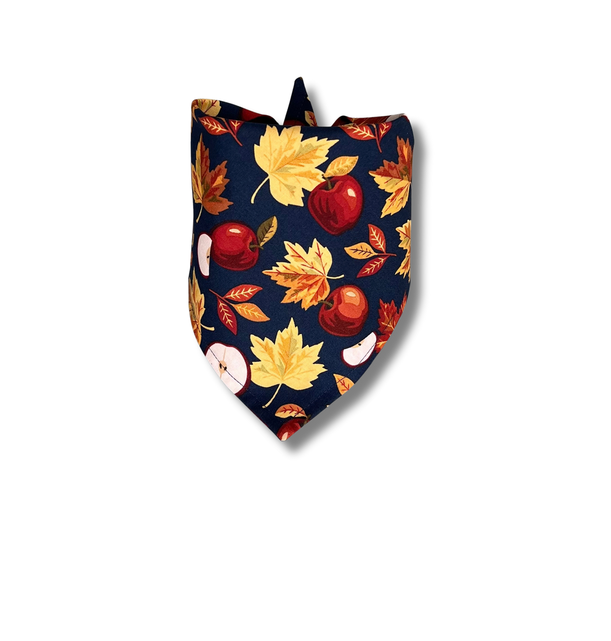 A navy blue bandana-style pet collar or neck scarf featuring an autumn pattern of maple leaves, acorns, and apple slices, shown on a plain white background.